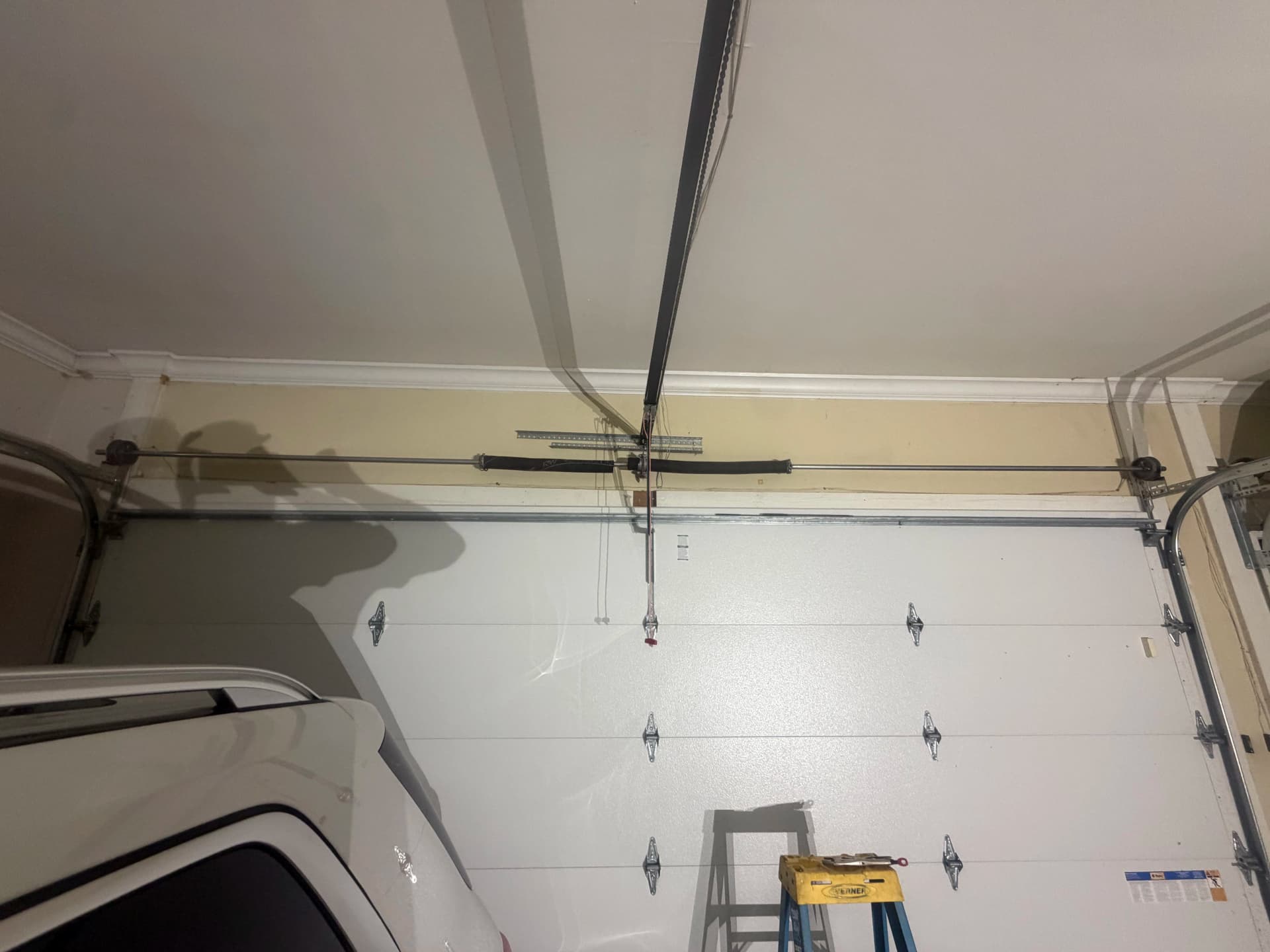 Broken Torsion Spring Repair That Gets Your Door Moving Again image