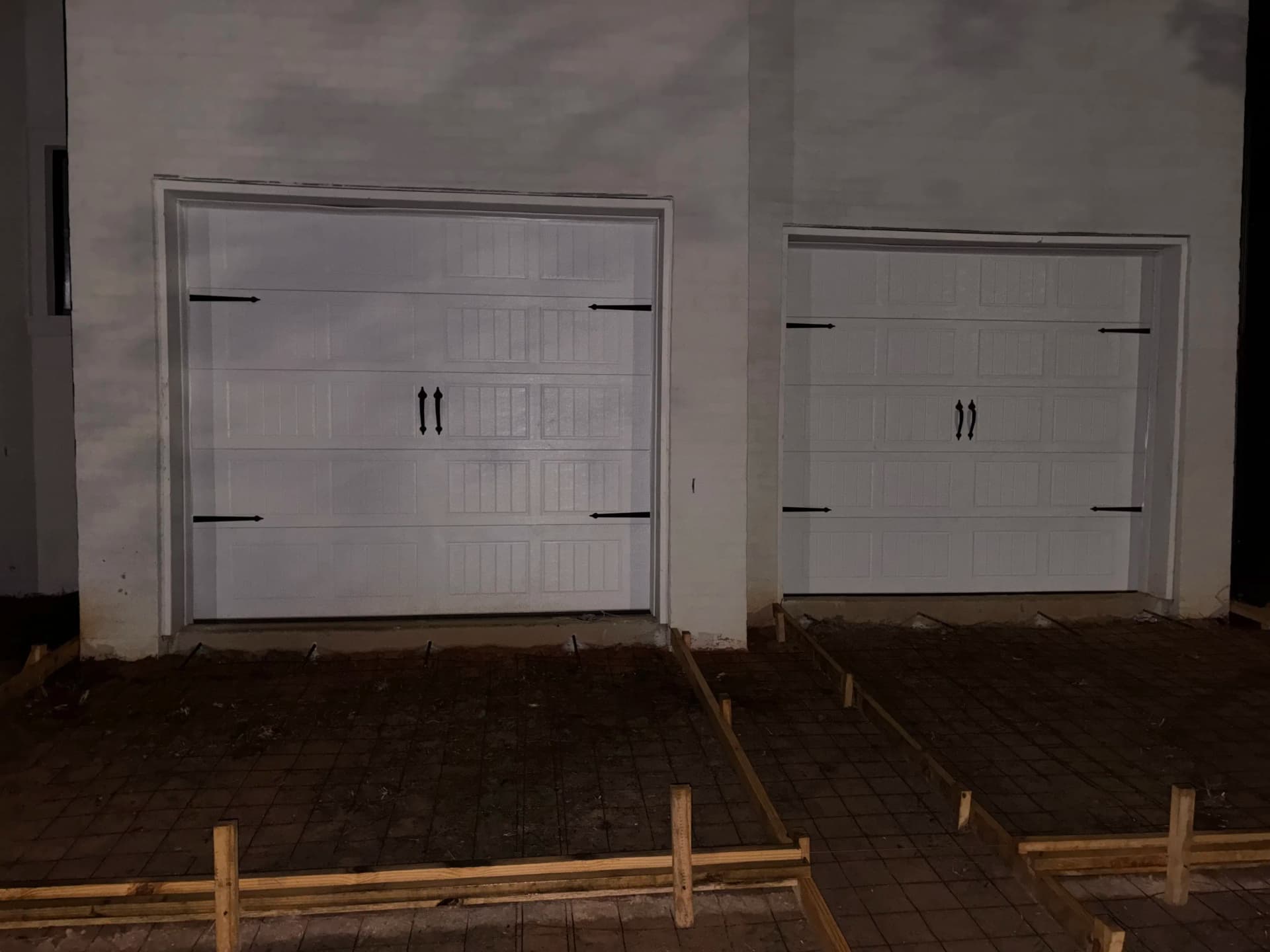 Two New Garage Doors Installed on a Fresh Build image